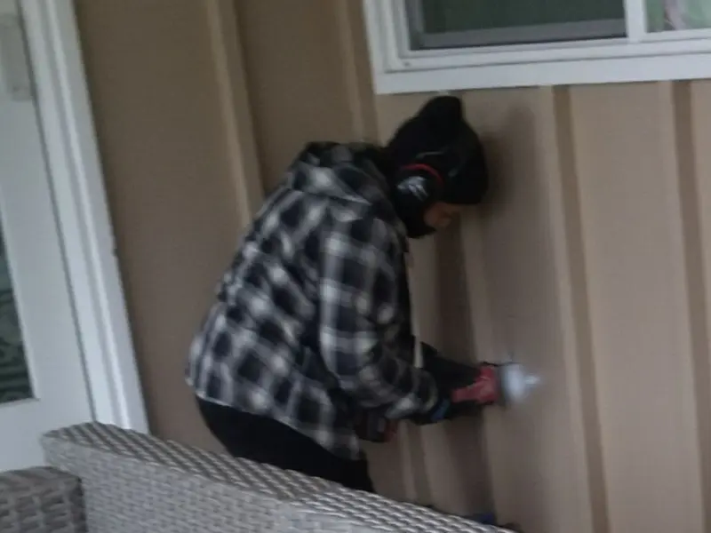 Professional electrician installing an exterior outlet in Lanham